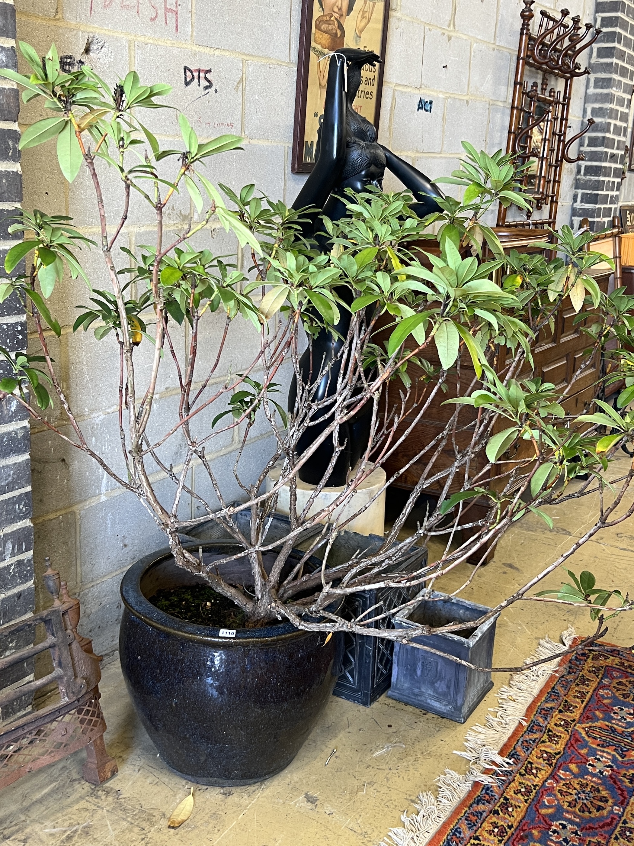 A large circular glazed earthenware garden planter, diameter 50cm, height 41cm